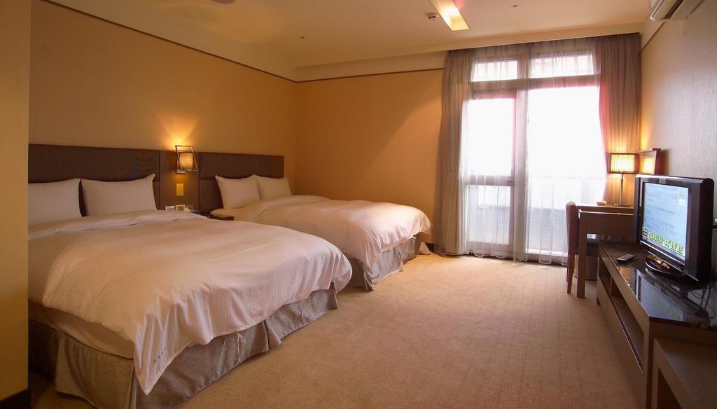 Rhine Inn Цзилун Номер фото